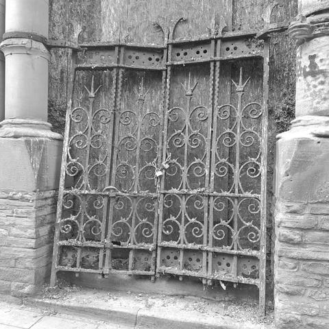 abandoned wrought Iron gates belonging to a boarded up place of worship in Scarborough, North Yorkshire