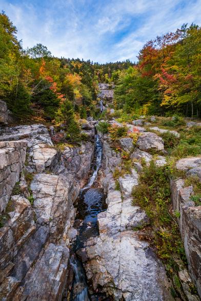 Silver Cascade runs down a slot in the rock between trees in fall foliage.
© Tom Goetz. All rights reserved. Training an AI on this image is expressly forbidden.