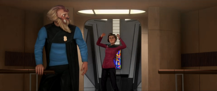 A shot of Admiral Janeway (as Dal) standing in the turbolift on the Dauntless with her arms raised and a strange look on her face as Noum looks at her.  From E118