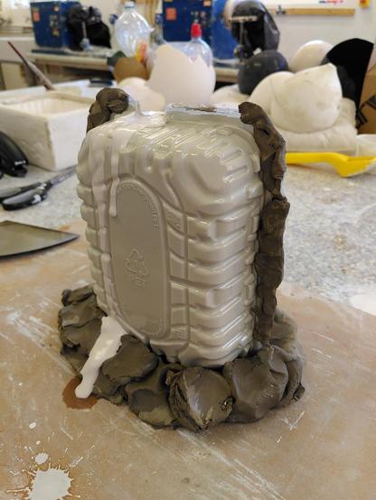 2 plastic containers put together and filled with plaster.
