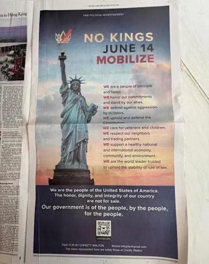 A photograph of the No King's June 14 mobilise full-page ad in an American newspaper, sponsored by Christie Walton, the heiress to the Walmart Empire.