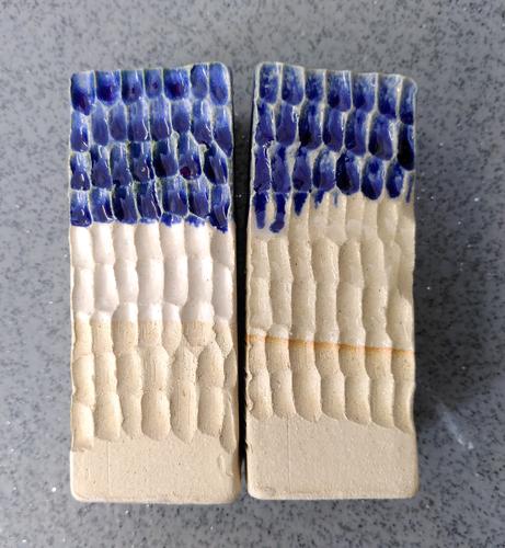 2 ceramic test tiles for white, clear and glossy navy blue glazes selected for the project.