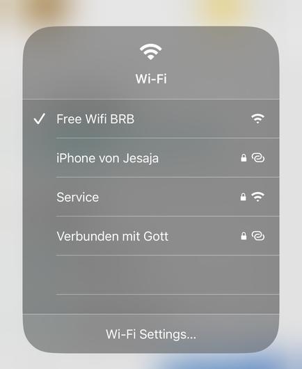 Screenshot of wifi networks, one called „Verbunden mit Gott“ (connected with god)