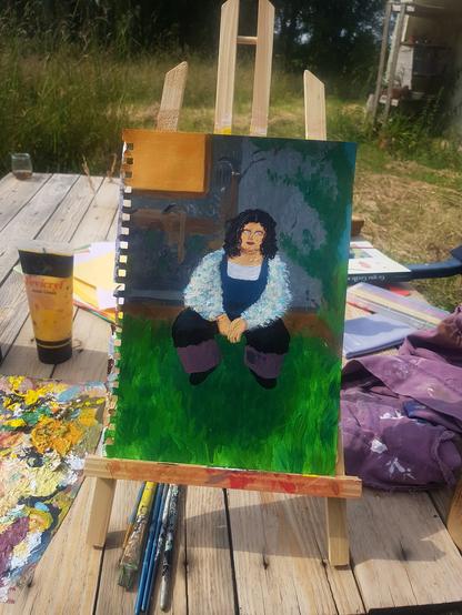 Même peinture mais photo prise plus tôt. On voit quelques détails pas encore peins comme l'herbe à ses pieds, pluss de couleurs dans son pull, le tableau au fond de la pièce