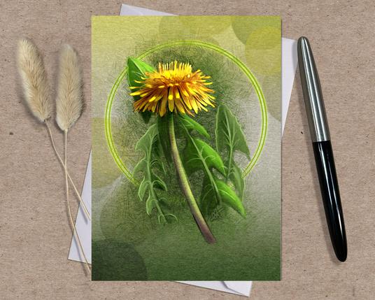 Product photograph of an illustrated dandelion greeting card, posed on a white envelope on a kraft paper background. Predominant colors are golden yellow and green.