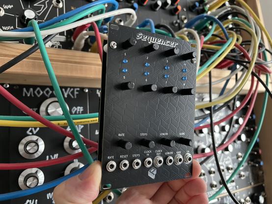 Fully assembled unit with 8 blue leds, 8 I/o jacks on the bottom, 8 pots for each step and controls for rate, step count, gate length and glide