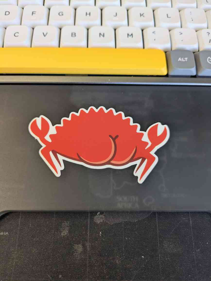 Picture of a sticker representing the back of Ferris, the rust mascot. It has two nice round buttocks