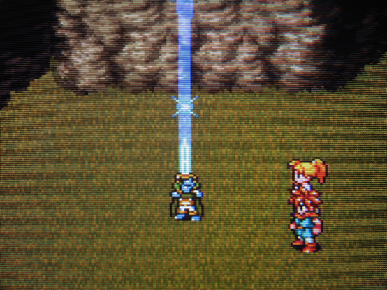 Frog hefts the empowered Masamune skyward. Blue, sparkling energy beams to the heavens. No mountain will prevent his righteous vengeance.