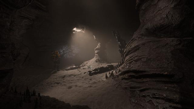 Star citizen screenshot: An astronaut in a yellow space suit is exploring a cave.