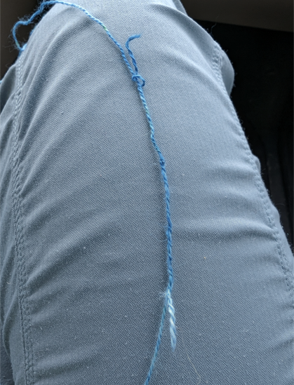 splice completed - both strands are looped together and pulled back into themselves, with a fuzzy end sticking out