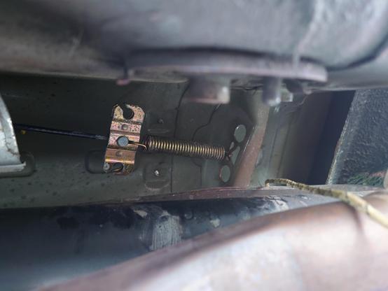 Looking up at the parking brake yoke in the transmission tunnel, above the exhaust/drive shaft/PPF. They say this is hard to work with but I had both hands up here and no trouble at all with the clips or cables.