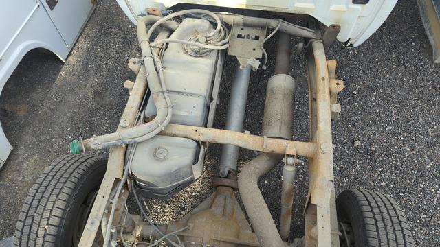 A top down view of the 2007 GMC Sierra 2500HD. I'm standing on the frame over the spare tire mount, looking down at the frame. The fuel tank, exhaust, rear axle, and driveshaft are all visible (and easy to work on from this angle).