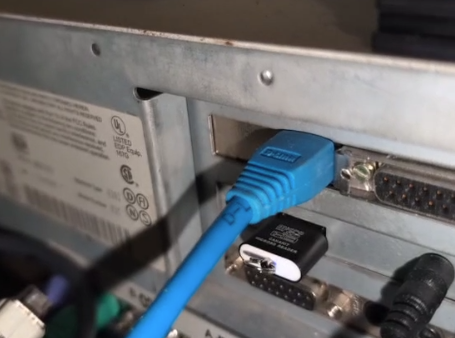 back ports of a vintage IBM PC, we see a network cable, a microSD card adapter, a couple of cables coming out of a PicoGUS sound card