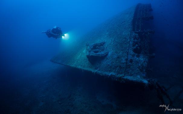 Scuba diver at the bow of the wreck SS Brioni
