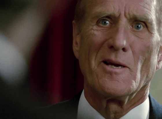 ChatGPT describes the image as "The image captures an intense close-up of an older man with a deeply etched face, conveying a mixture of urgency and concern. His slightly parted lips and focused blue eyes suggest he is in the middle of delivering crucial information or responding to a tense situation. The soft, out-of-focus background combined with his formal attire indicates a serious setting, possibly a meeting or confrontation. The lighting emphasizes the lines on his face, underscoring the weight of experience and the gravity of the moment. This scene likely unfolds during a pivotal moment where secrets, betrayal, or moral dilemmas are at play."

BotOfDarkness, version 2.0.23.