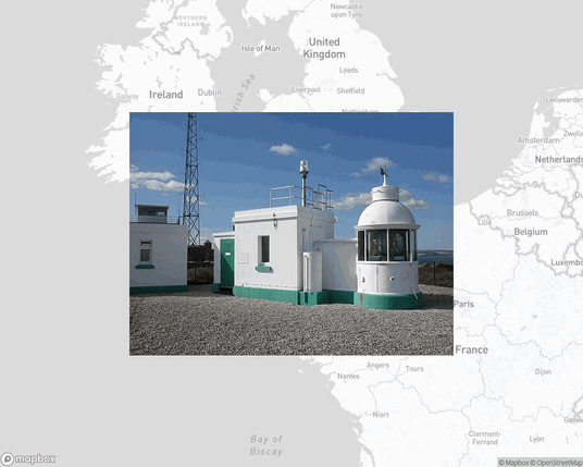 A photo of a lighthouse from the linked website, overlaid on a cropped world map where it's located.