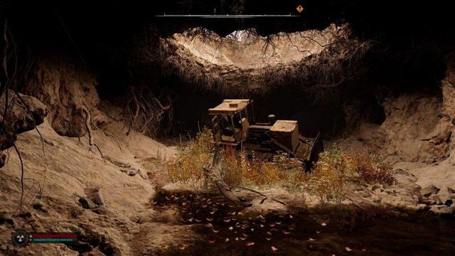 An underground cave with a on top with the skies and a tractor in the cave