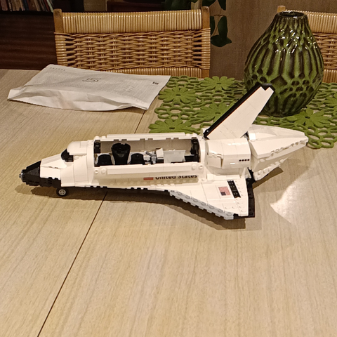 Lego mini space shuttle with its engine exhaust removed and packed in the cargo bay