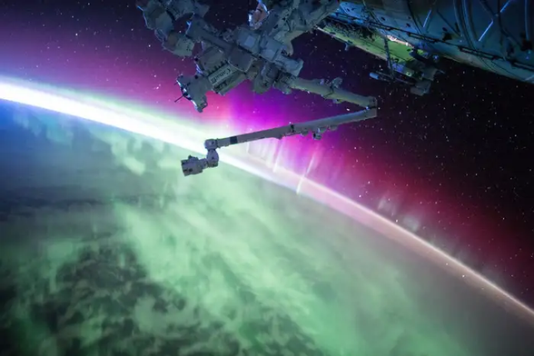 A picture (not sure how much manipulation has gone on) of a satellite above the earth with the caption Electromagnetic phenomena, such as the aurora, might leave an imprint in space-time
NASA Johnson