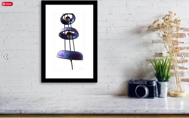 Wind chime art work on white in a black frame in a furniture setting by artist and poet Sharon Cummings.  Haiku in post.