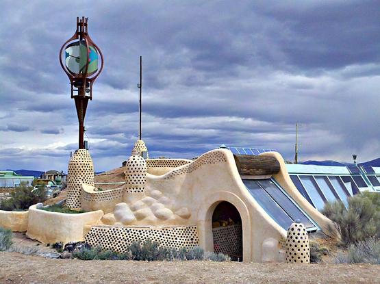 Photo of a building at the Earthship community in Taos, New Mexico. Attribution: Dameon Hudson.