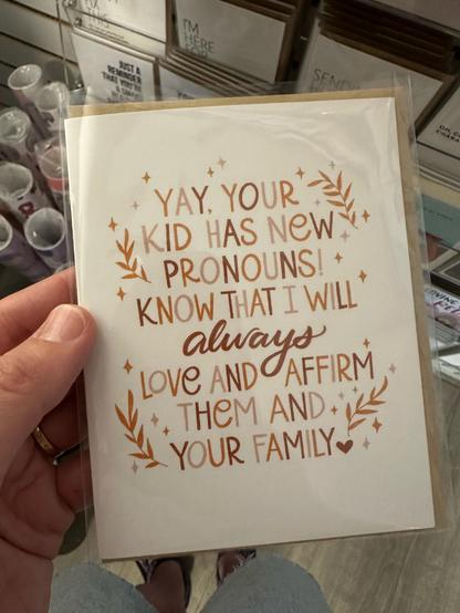 A greeting card that says “yay, your kid has new pronouns! know that I will always love and affirm them and your family”