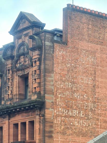 A ghost sign on the side of an old building in Glasgow.