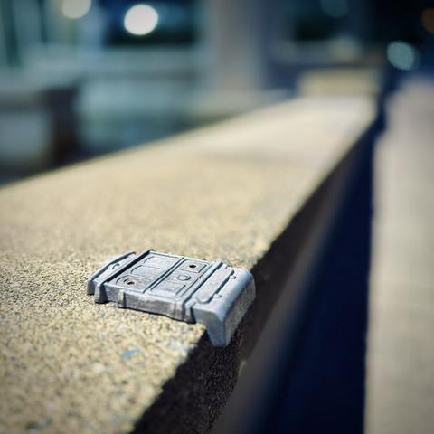 A perspective view shows a metallic streetcar design screwed down to the concrete ledge beneath it in the foreground and more blurred out down the ledge in the distance.
