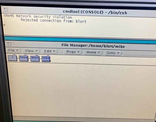 The console complains of an XNeWS network security violation, "rejected connection from blort" (itself.)
