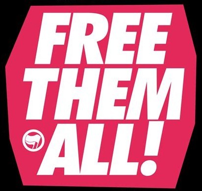Roter Hintergrund. Weiße Schrift: Free them all!