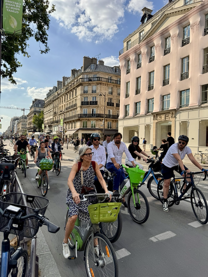A pair of street filled with people on bikes