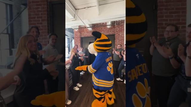 The only way to welcome Sabretooth to the office on National Mascot Day! 👏  #hockey #mascot #nhl