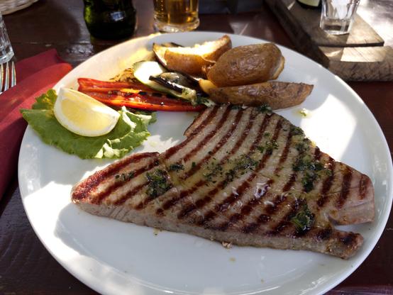A rather big slice locally caught and freshly served, grilled tuna steak