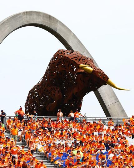 Fans, all dressed in orange, fill the stands at the Red Bull Ring.