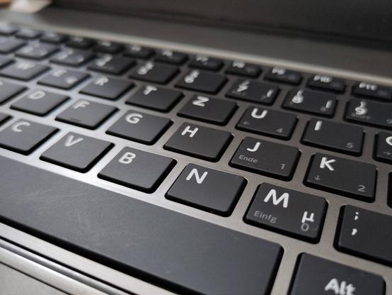 Close-up picture of a laptop keyboard.