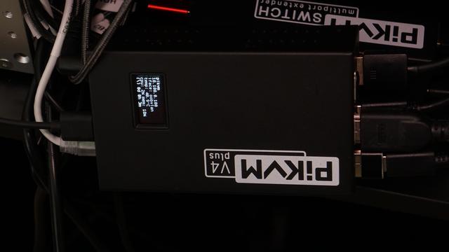 The PiKVM OLED display showing the IP address and the interface name (`oobvlan`).