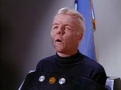 A disfigured Captain Pike in a wheelchair