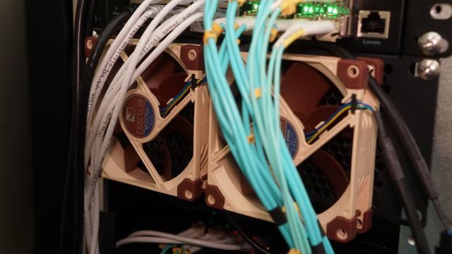 Two Noctua NF-9A PWM fans that have been screwed onto the outside of a 2U minirack plate.