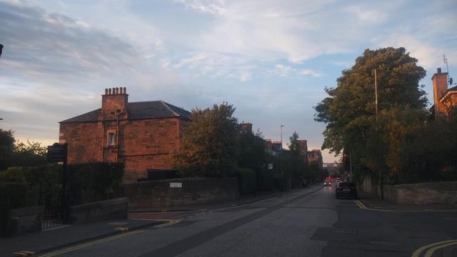 Victorian stone mansions glowing deep copper as the midsummer sunset light bathed it late in the evening