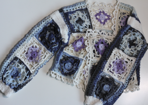 Cardigan from above on a white surface