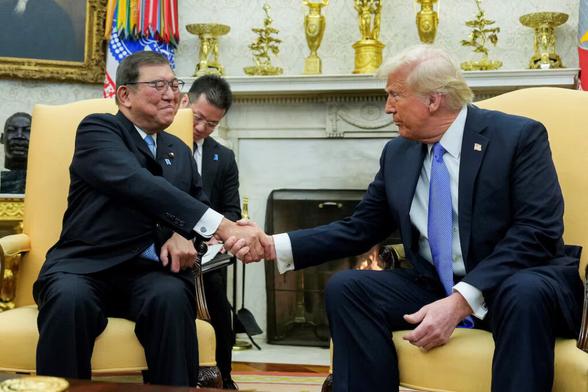 US President Donald Trump shakes hands with Japan's Prime Minister Shigeru Ishiba at the White House in Washington, US, February 7, 2025. REUTERS/Kent Nishimura/File Photo