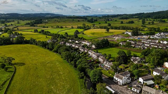 aerial shot of town and fields