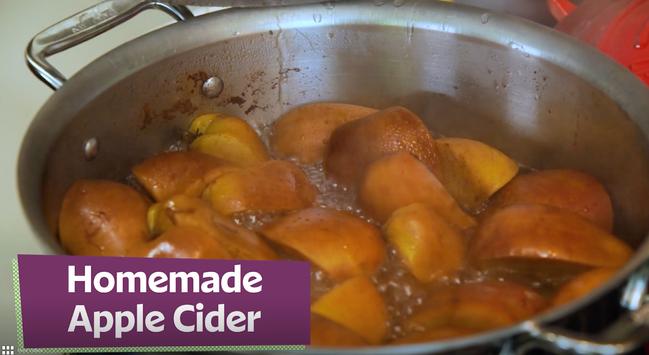 Picture of Apples stewing in a pot, with the label "Homemade Applce Cider".
