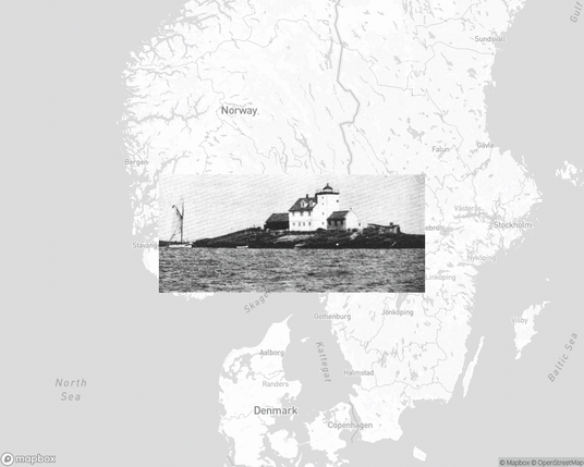 A photo of a lighthouse from the linked website, overlaid on a cropped world map where it's located.