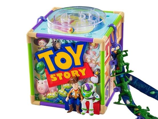 Colorful Toy Story Bucket with mini figures of Woody, Buzz Lightyear, and green army men on the side.