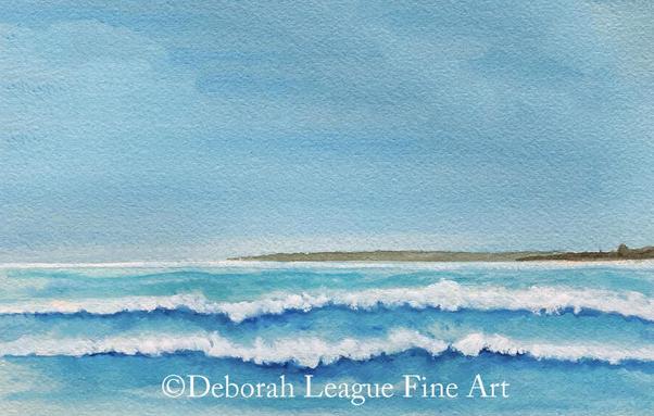 Enhance your home or office with the calming essence of the ocean with my original watercolor art print "Caribbean Waves Rush To Shore.  Painted in the tranquil turquoise and aqua blue colors of an island sea.  Waves crash gently against one another below a light blue sky, with a thin strip of land visible in the distance. The calming scene reflects the tranquility of a seascape with soft colors blending seamlessly.