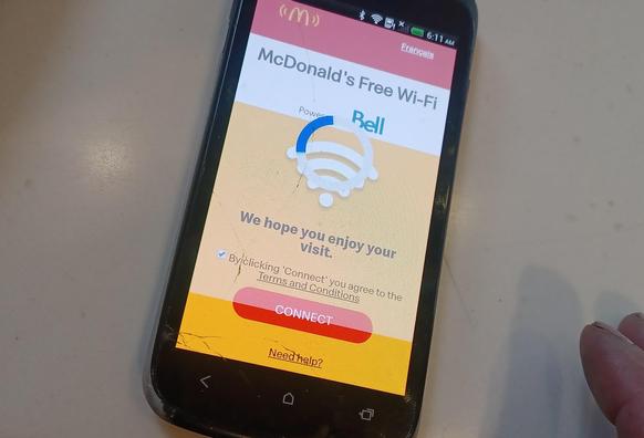 HTC One S slowly spinning its progress wheel on McDonald's free WiFi "Connect" screen.