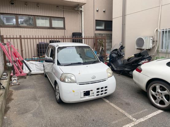 2004 Daihatsu Esse parked in back yard.