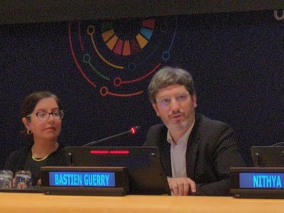 Bastien speaking at a UN microphone.