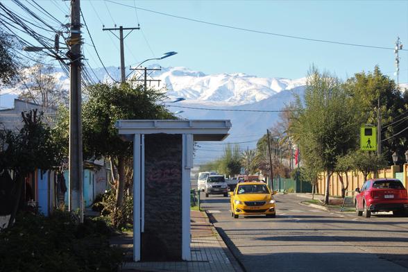 a street in Mostazal , snowed Andes at background